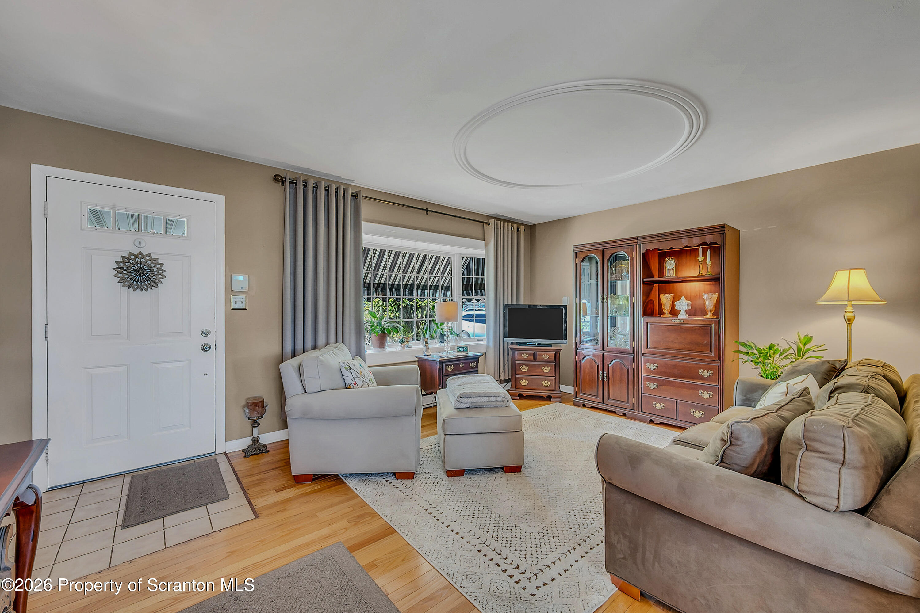 1832 West Gibson Street Scranton, PA 18504 - Photo 6 of 54 a living room with furniture and a large window