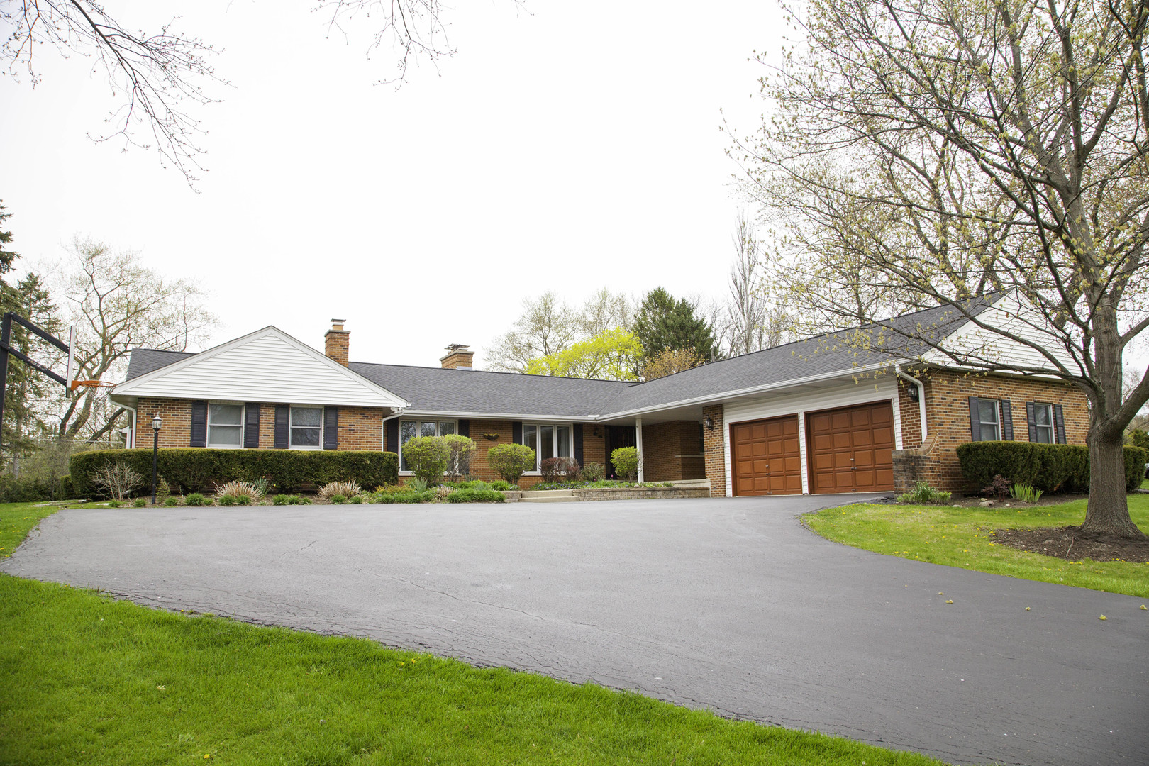 1630 Dunbar Road Inverness, IL 60067 - Photo 1 of 8 a front view of house with yard and green space