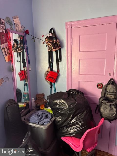 518 South 55th Street Philadelphia, PA 19143 - Photo 3 of 49 a bedroom with a bed with closet and pillows