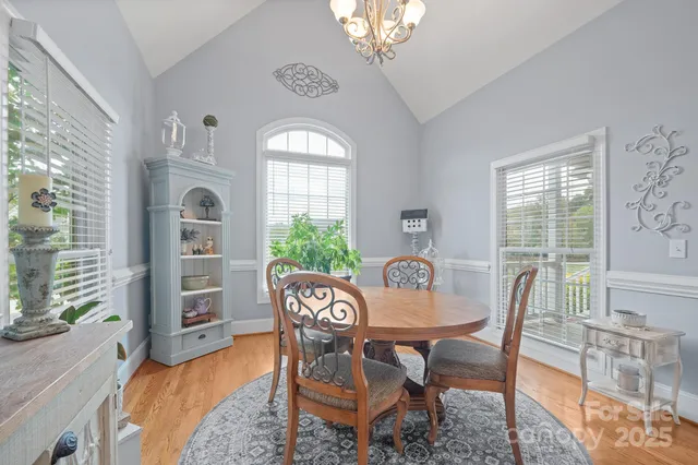 a view of a livingroom with furniture window and wooden floor