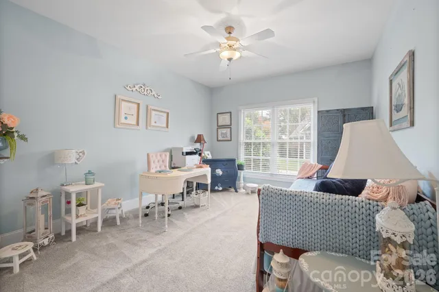 a view of a workspace with furniture