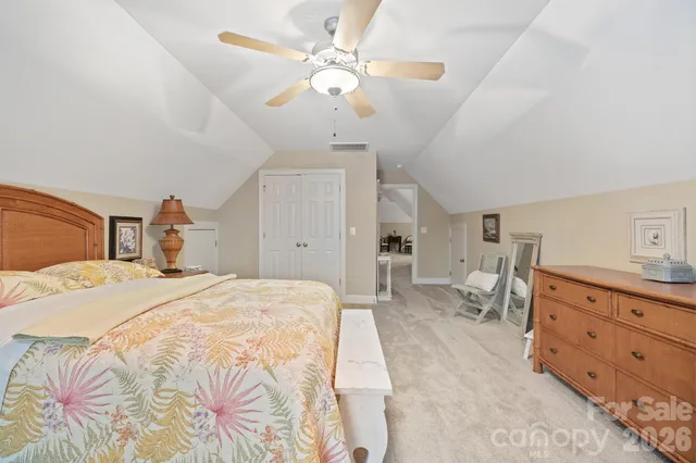 a bathroom with a tub a double vanity sink and a mirror