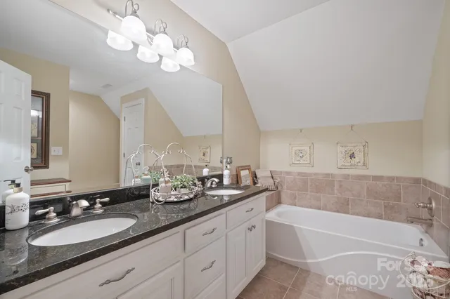a living room with furniture a chandelier and a piano