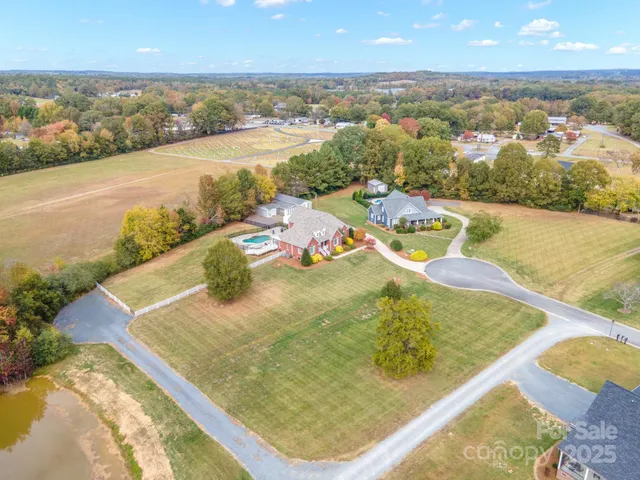 a front view of house with yard and trees