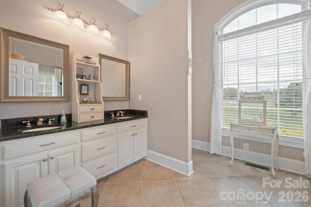 a kitchen with granite countertop a sink and a stove