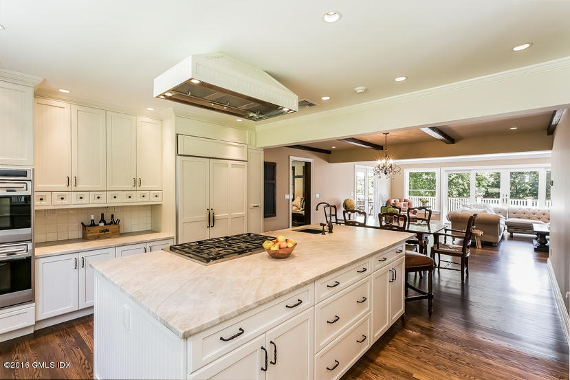 102 Hunting Ridge Road Greenwich, CT 06831 - Photo 11 of 29 a kitchen with a stove a refrigerator and wooden floor