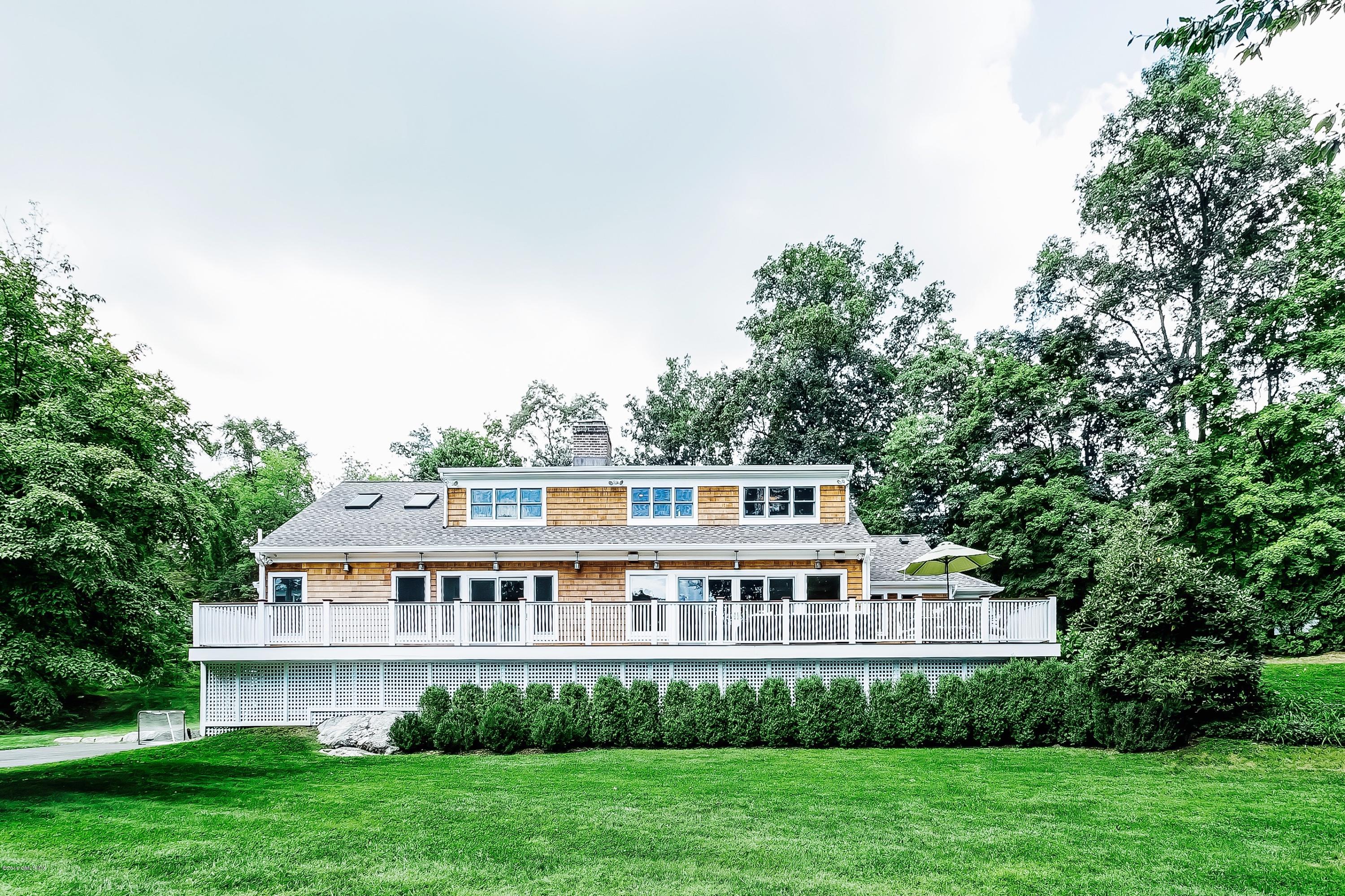 102 Hunting Ridge Road Greenwich, CT 06831 - Photo 4 of 29 a view of a house with a big yard