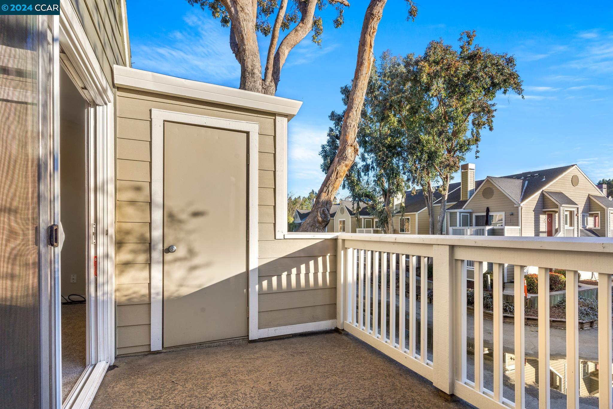 285 Reflections Drive, Unit 25 San Ramon, CA 94583 - Photo 17 of 42 a view of a house with a small yard and a large window