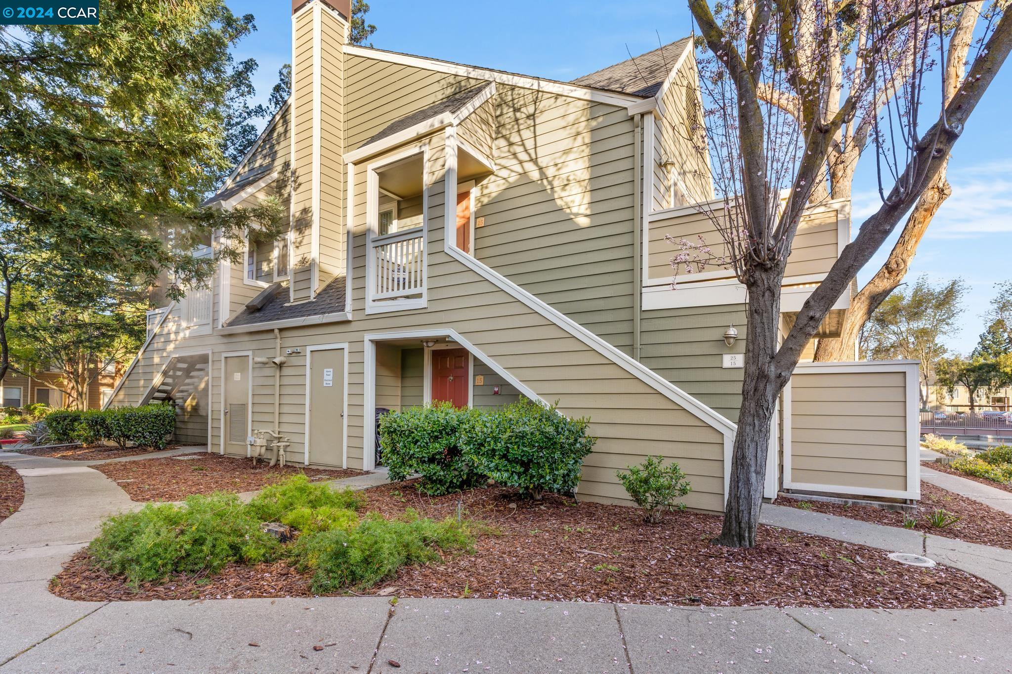 285 Reflections Drive, Unit 25 San Ramon, CA 94583 - Photo 2 of 42 a view of a house with a yard and sitting area