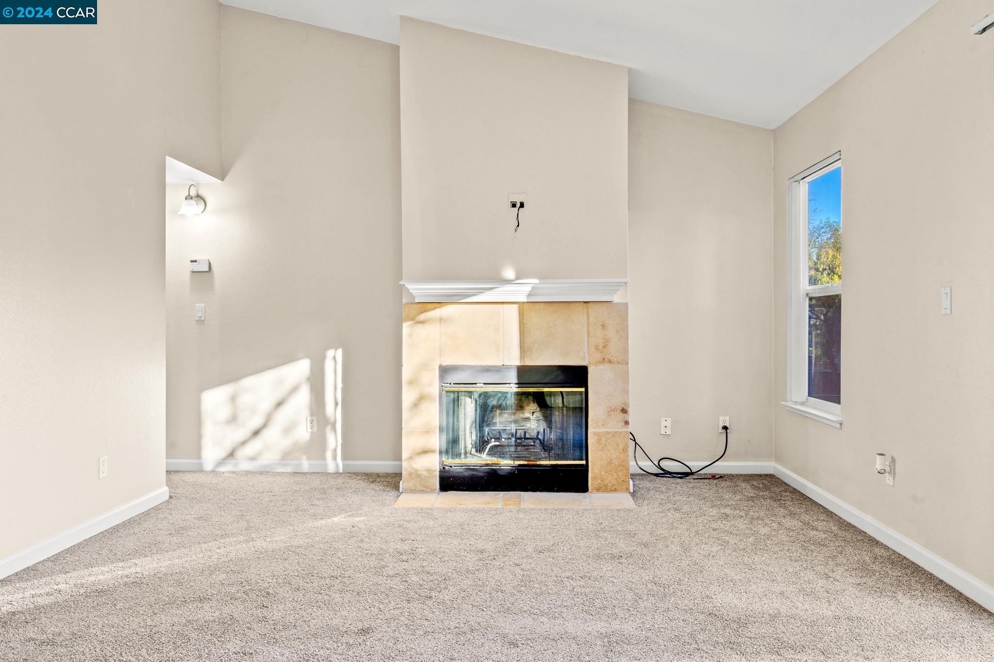 285 Reflections Drive, Unit 25 San Ramon, CA 94583 - Photo 3 of 42 a living room with furniture window and fireplace