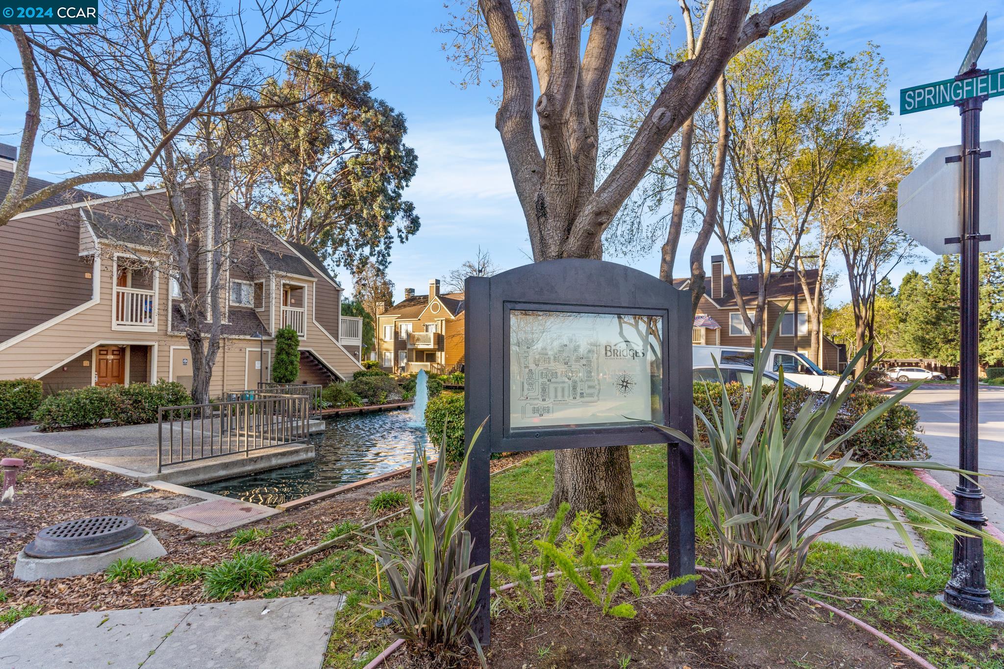 285 Reflections Drive, Unit 25 San Ramon, CA 94583 - Photo 40 of 42 a view of a brick house with a large tree