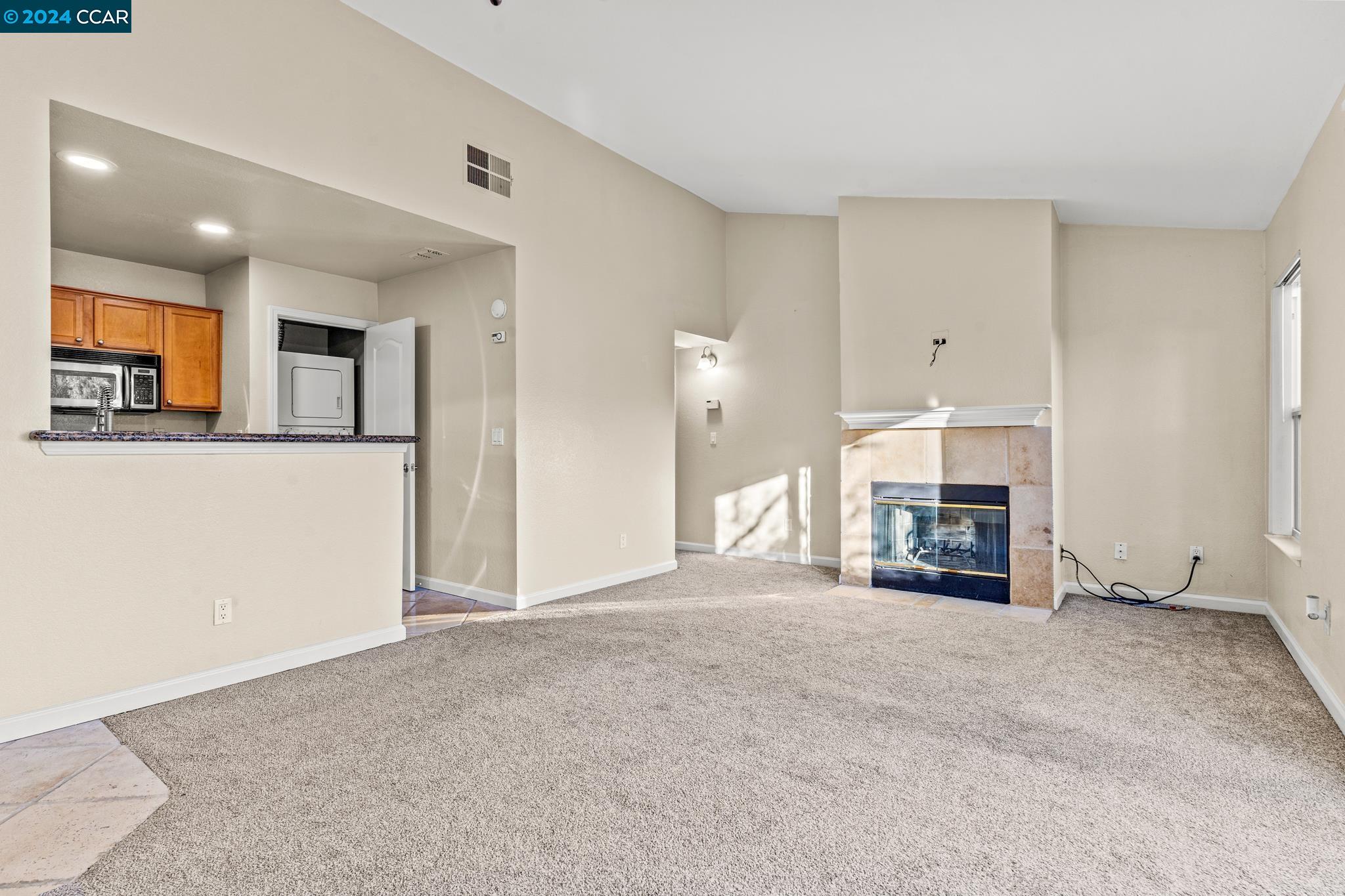 285 Reflections Drive, Unit 25 San Ramon, CA 94583 - Photo 6 of 42 a view of empty room with fireplace