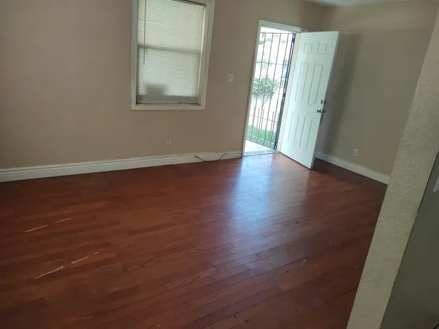 a room with a sink and cabinets