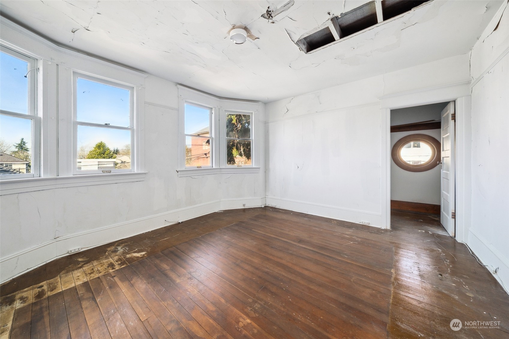 3840 Linden Avenue North Seattle, WA 98103 - Photo 17 of 40 an empty room with window and wooden floor