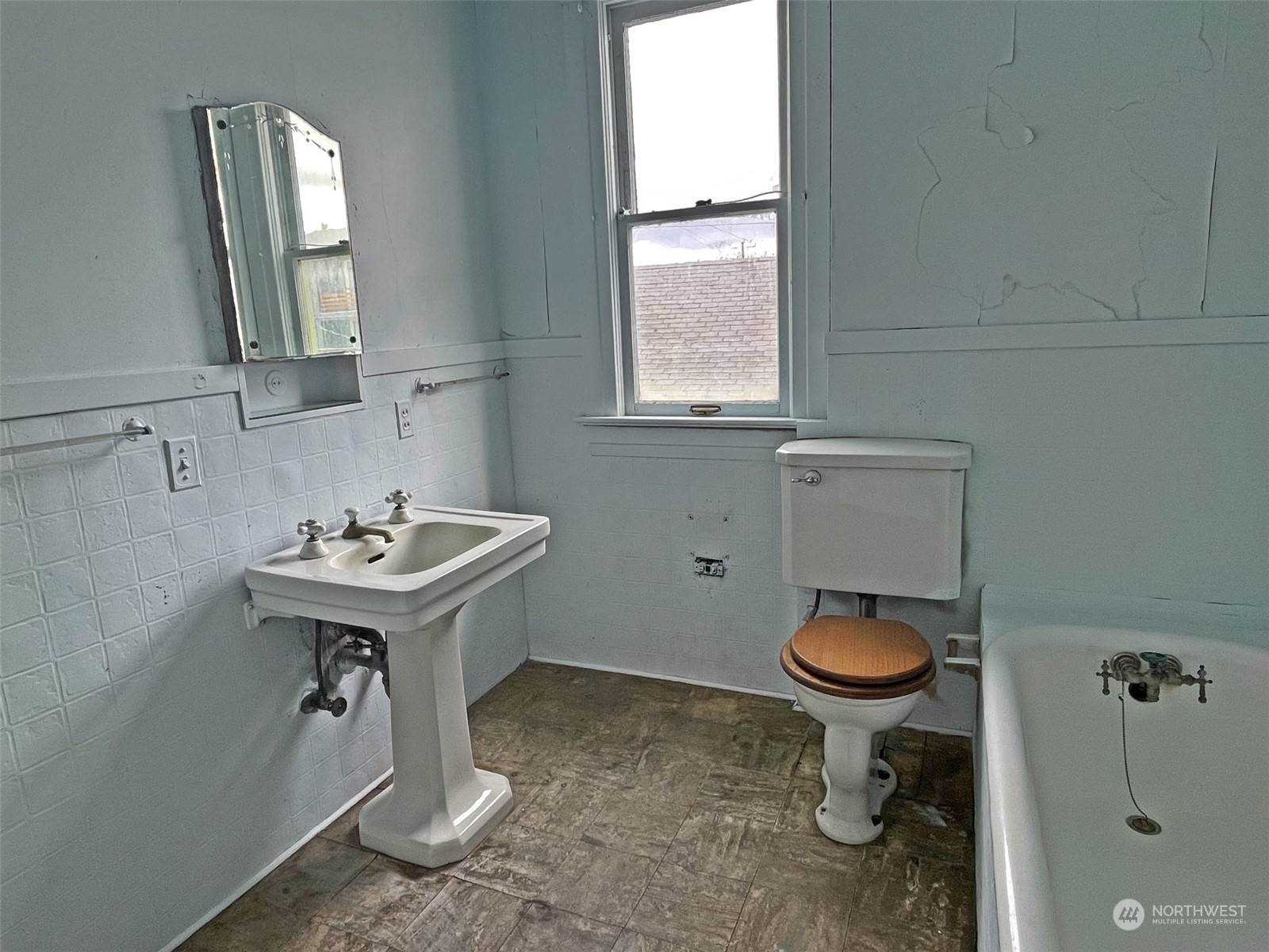 3840 Linden Avenue North Seattle, WA 98103 - Photo 19 of 40 a bathroom with a sink toilet and a mirror