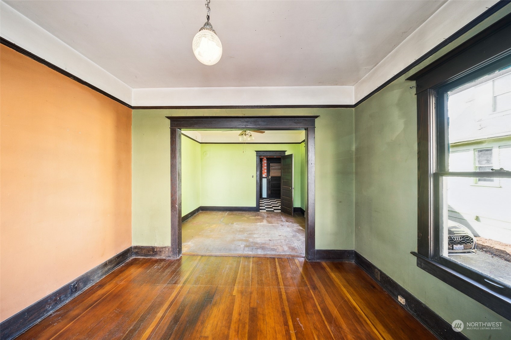 3840 Linden Avenue North Seattle, WA 98103 - Photo 30 of 40 a view of a room with wooden floor and a window