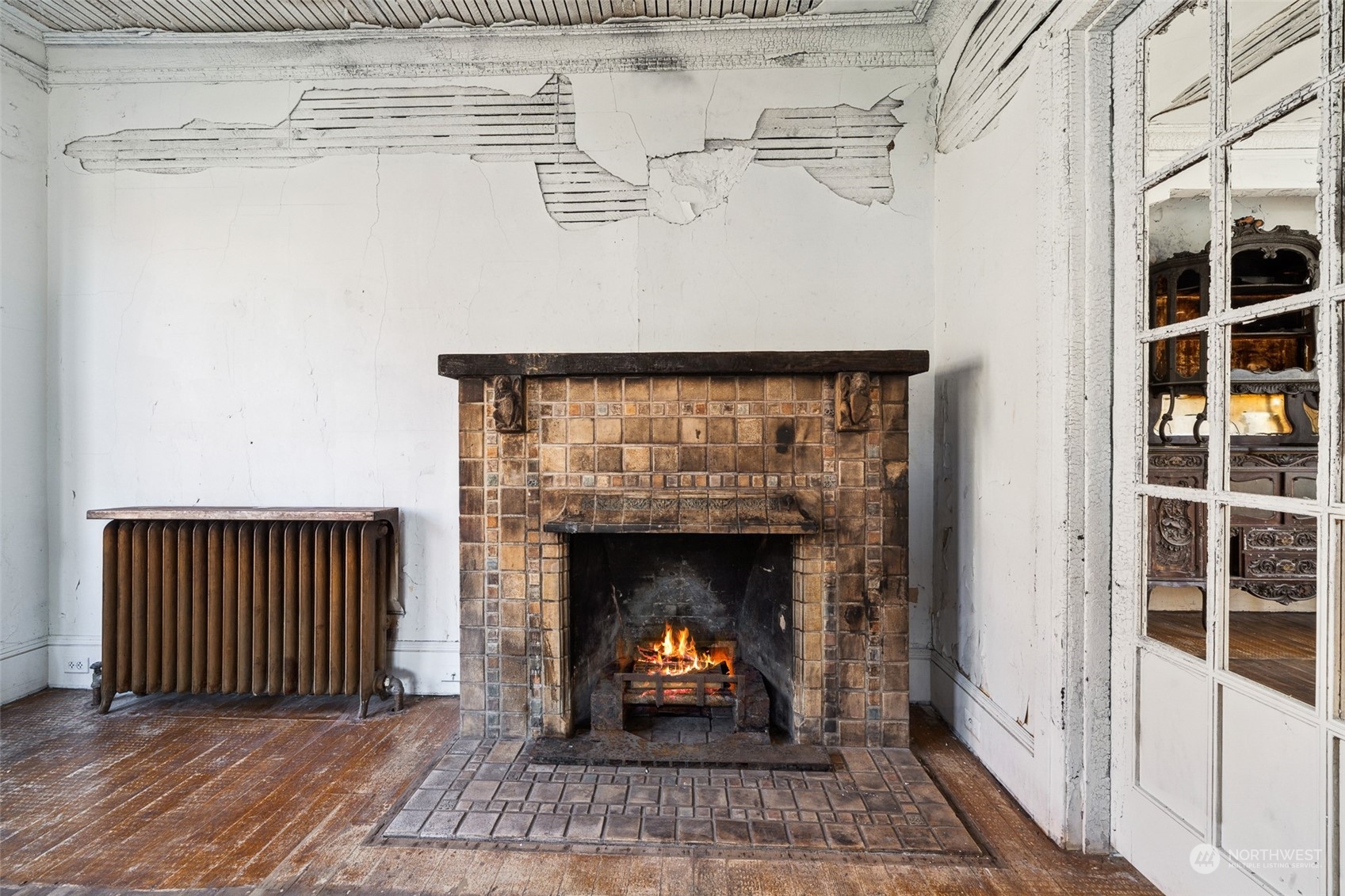 3840 Linden Avenue North Seattle, WA 98103 - Photo 6 of 40 a living room with furniture and a fireplace
