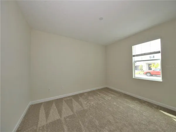 a view of a room that has a window in it