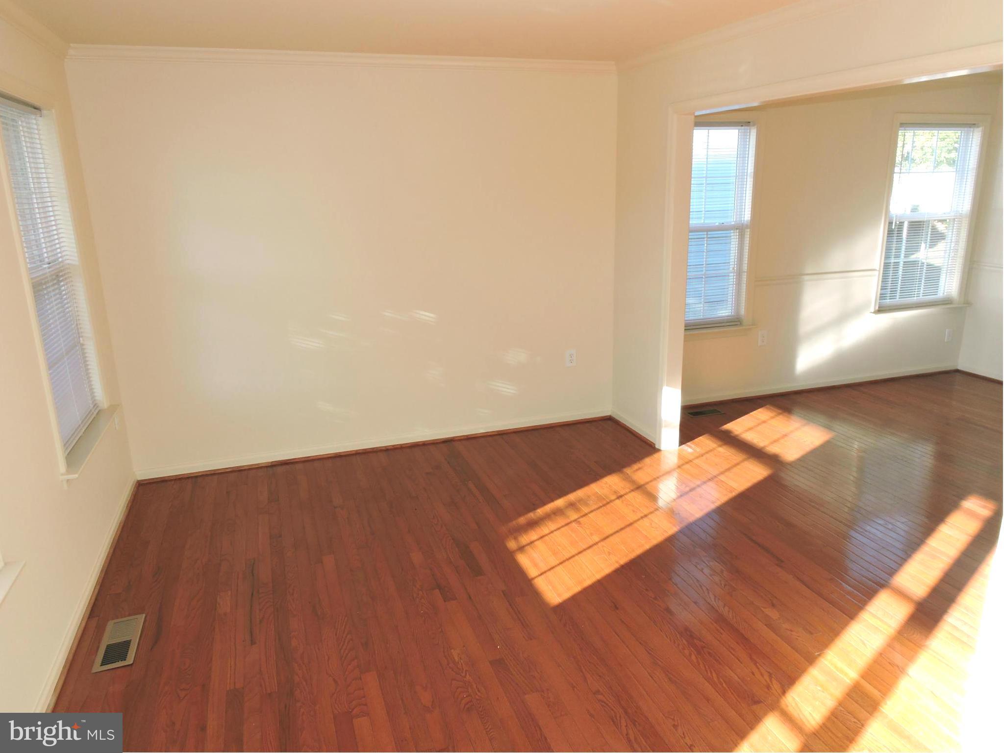 132 Ranson Estates Circle Ranson, WV 25438 - Photo 4 of 30 Sunny living room with hardwood floors opens to