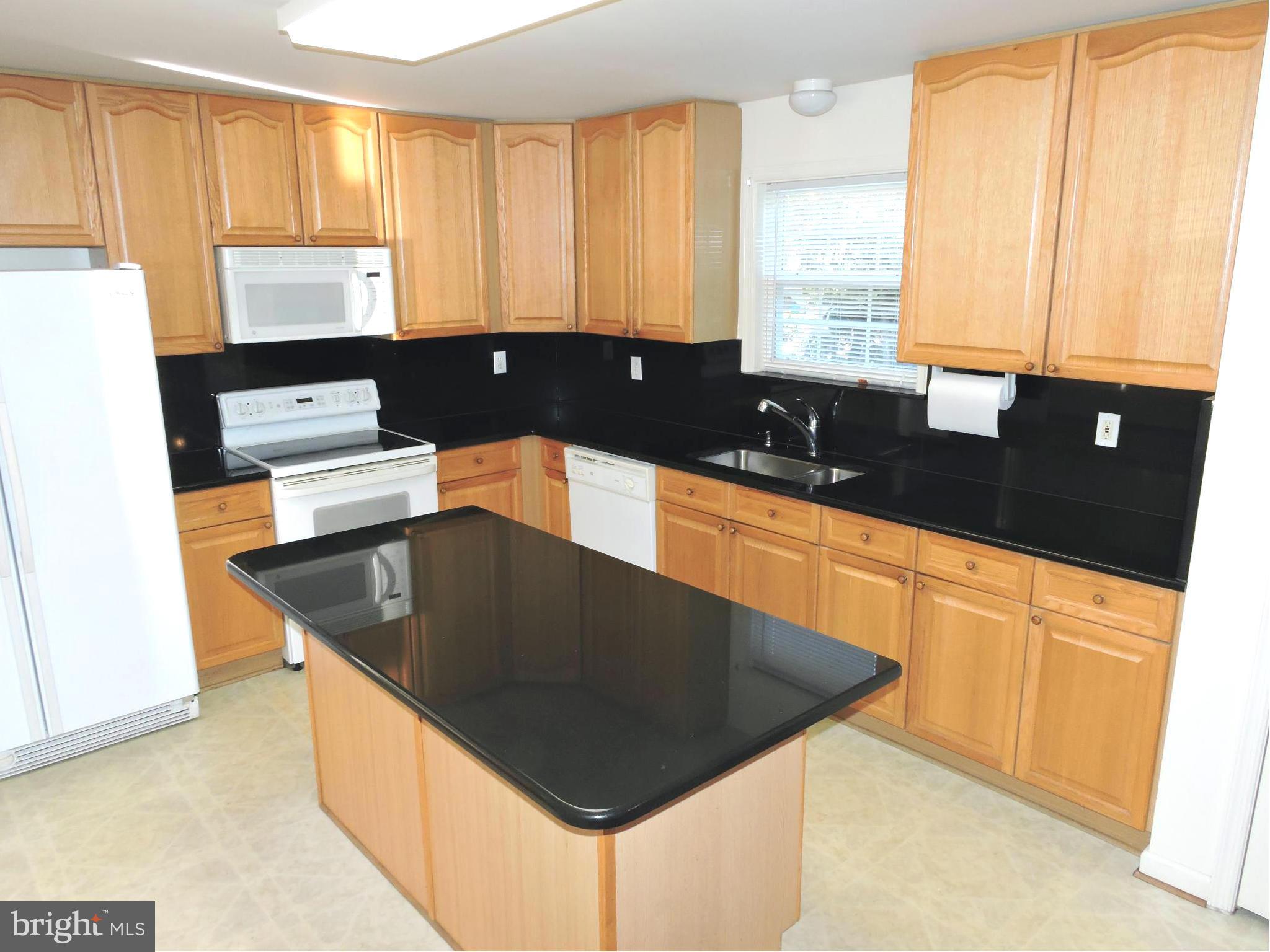 132 Ranson Estates Circle Ranson, WV 25438 - Photo 7 of 30 Spacious kitchen has loads of cabinets, granite