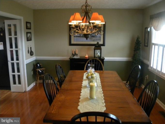 2930 Apple Pie Ridge Road Winchester, VA 22603 - Photo 2 of 24 a view of a dining room with furniture and chandelier