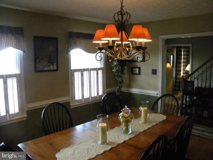 2930 Apple Pie Ridge Road Winchester, VA 22603 - Photo 18 of 24 a dining room filled chandelier and wooden floor