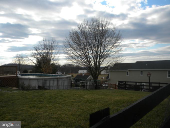 2930 Apple Pie Ridge Road Winchester, VA 22603 - Photo 3 of 24 a backyard of a house with lots of green space