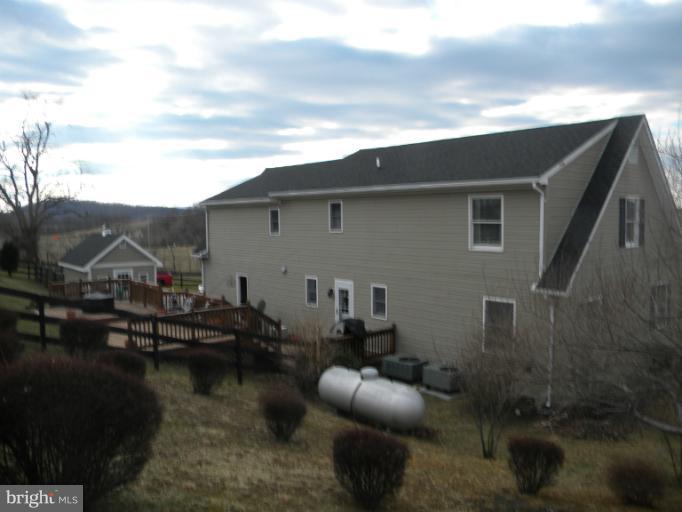 2930 Apple Pie Ridge Road Winchester, VA 22603 - Photo 22 of 24 a backyard of a house with seating space