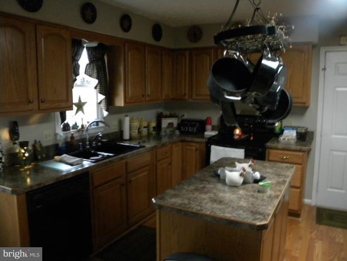2930 Apple Pie Ridge Road Winchester, VA 22603 - Photo 23 of 24 a kitchen with a sink cabinets and wooden floor