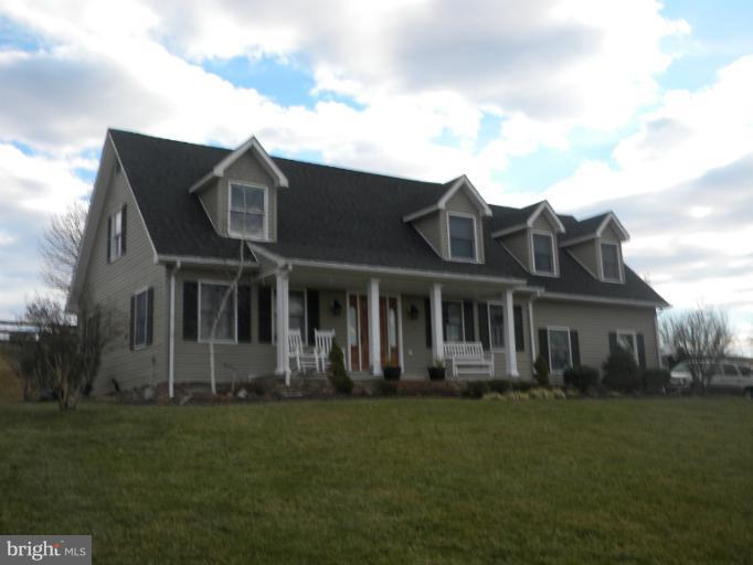 2930 Apple Pie Ridge Road Winchester, VA 22603 - Photo 24 of 24 a front view of a house with a garden