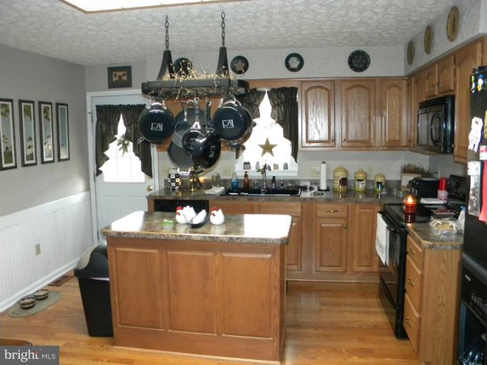 2930 Apple Pie Ridge Road Winchester, VA 22603 - Photo 4 of 24 a kitchen with stainless steel appliances granite countertop a sink dishwasher stove and cabinets