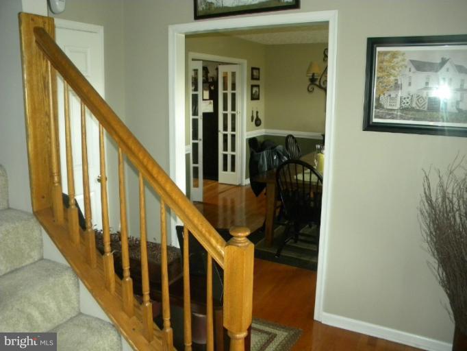 2930 Apple Pie Ridge Road Winchester, VA 22603 - Photo 10 of 24 a view of a hallway with wooden floor and stairs