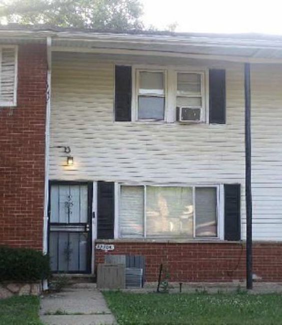 12109 South Indiana Avenue Chicago, IL 60628 - Photo 2 of 2 a view of house with a door and a yard
