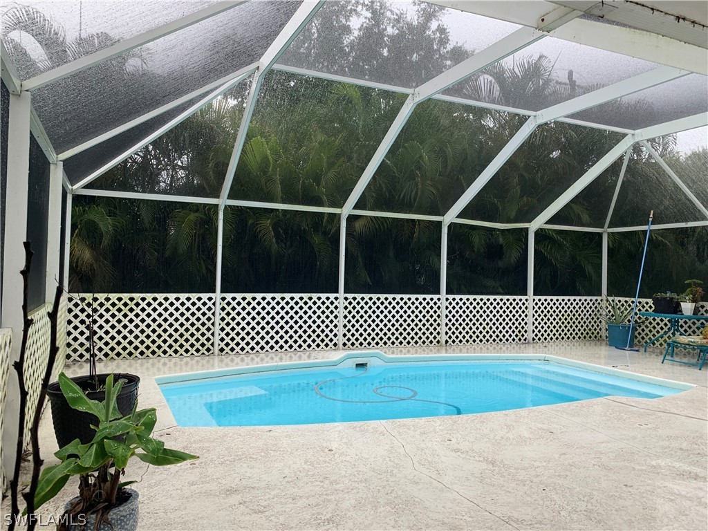 18599 Flamingo Road Fort Myers, FL 33967 - Photo 23 of 30 a view of a gate with wooden floor