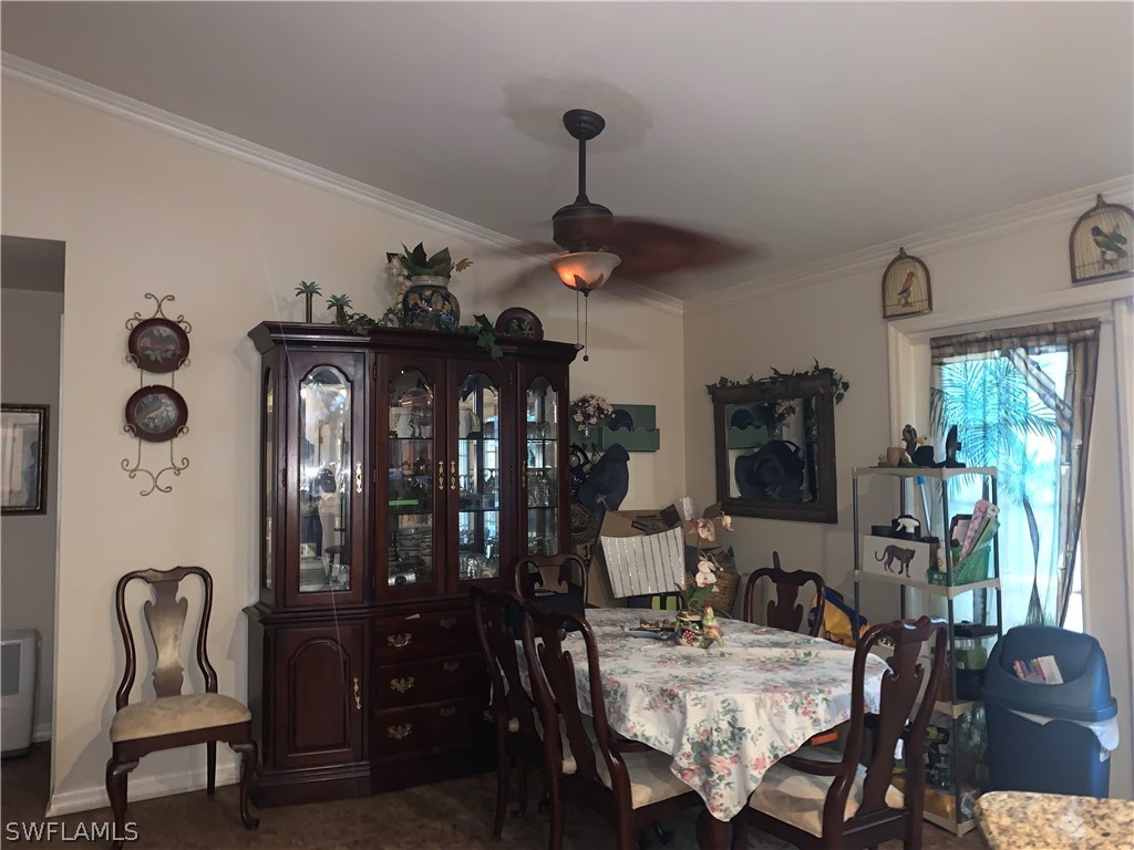 18599 Flamingo Road Fort Myers, FL 33967 - Photo 7 of 30 a view of a dining room with furniture and window