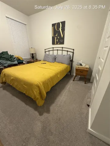 a bedroom with a bed and dresser