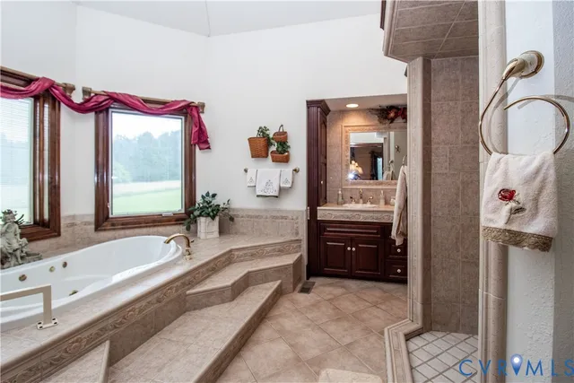 a bathroom with a granite countertop sink a large mirror and a shower