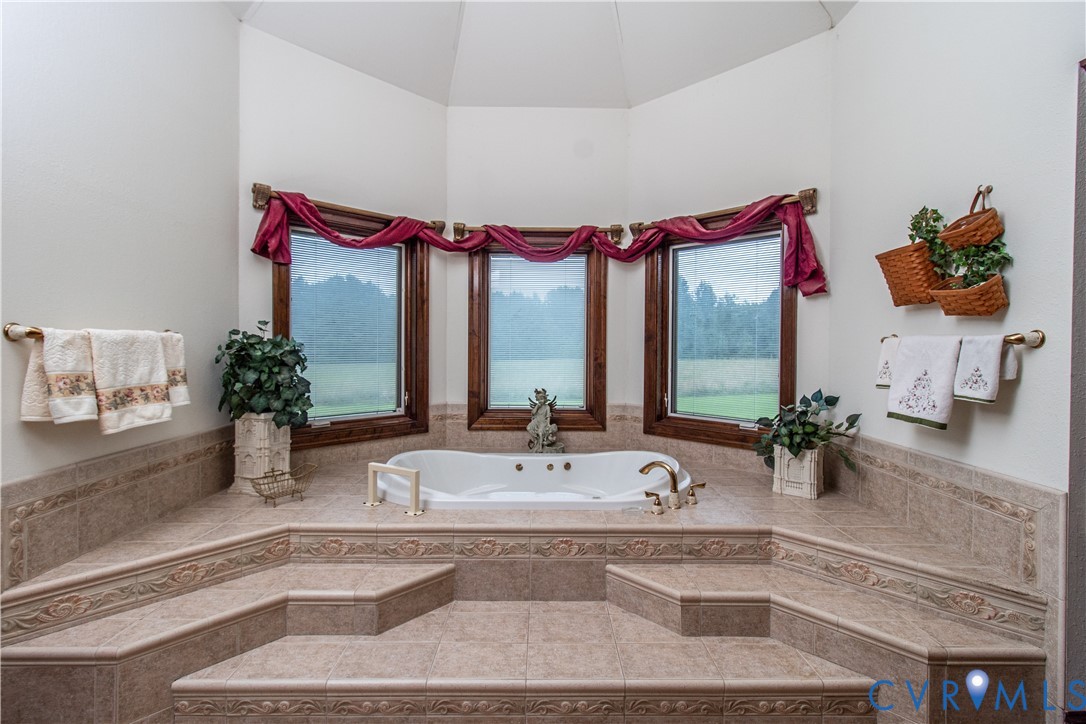 5301 Middle Road Prince George, VA 23875 - Photo 16 of 24 a bathroom with a double vanity sink and a tub