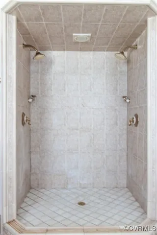 a living room with a large window and furniture