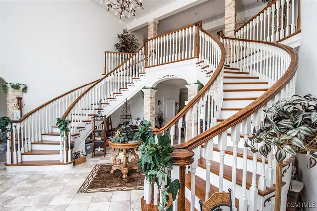 a view of entryway with wooden floor and a front door