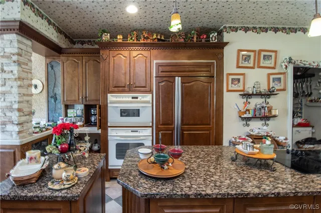 a kitchen with a refrigerator and stove