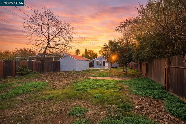 a backyard of a house with lots of green space