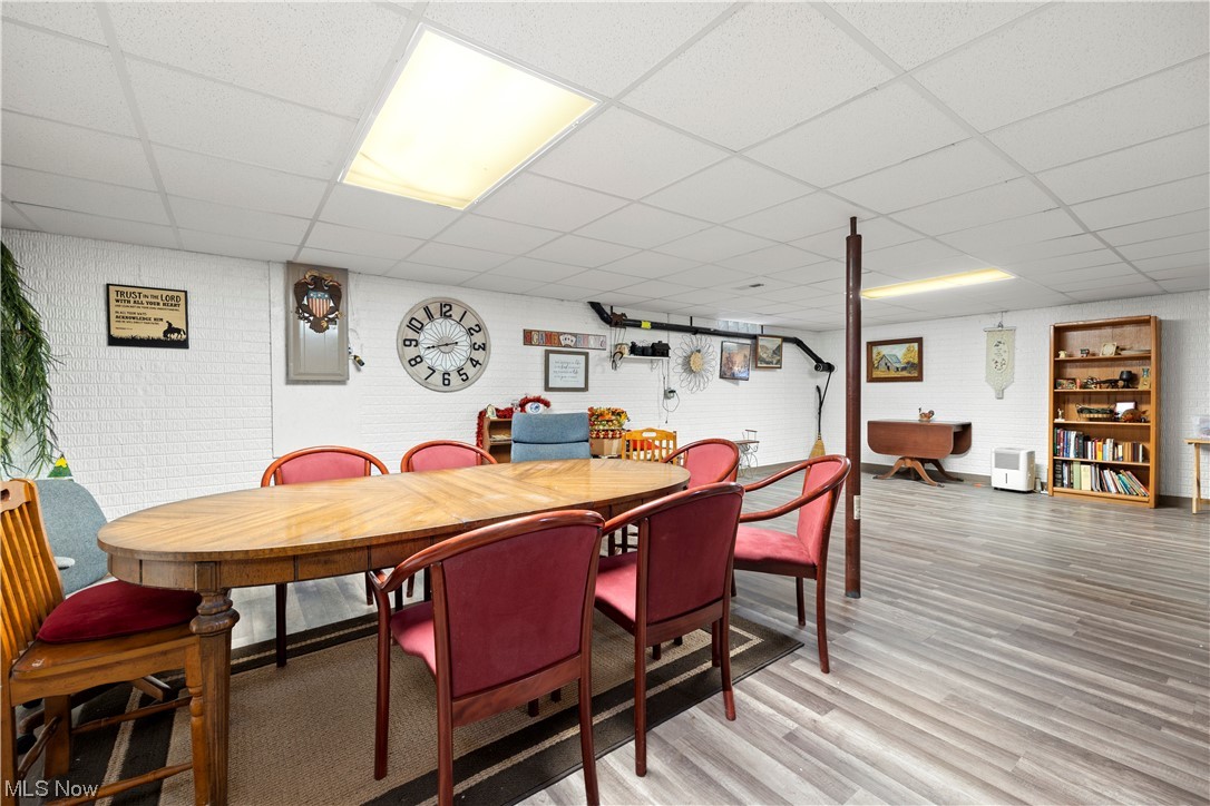 41038 Parsons Road Lagrange, OH 44050 - Photo 27 of 32 Dining area with a paneled ceiling and light hardwood / wood-style flooring