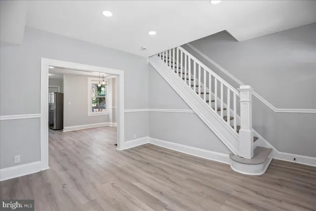 a view of entryway with wooden floor