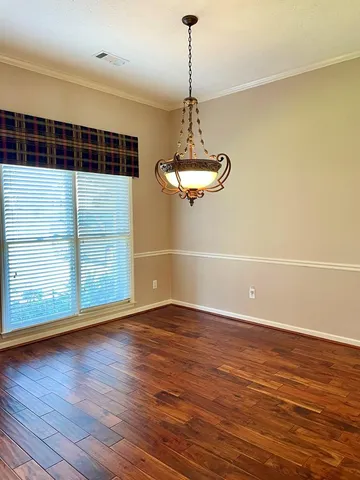 a kitchen with granite countertop a stove top oven cabinetry a sink and a counter space