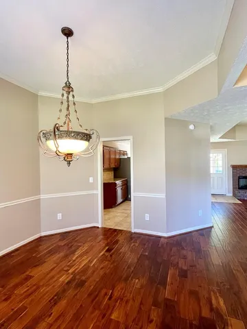 a kitchen with granite countertop a stove sink and cabinets
