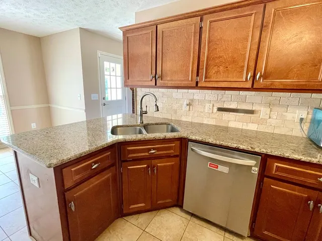 a view of a kitchen with a sink
