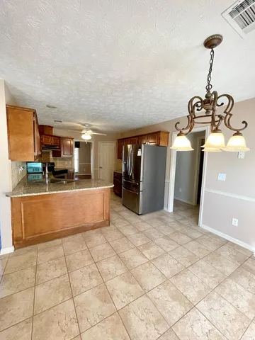 a view of room with window and ceiling fan
