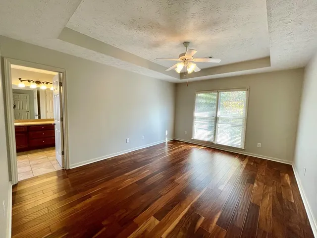 a swimming pool with some trees in the background