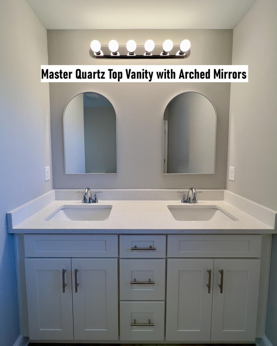 430 Scooter Cove Crestview, FL 32539 - Photo 4 of 4 a bathroom with a sink a mirror and a vanity